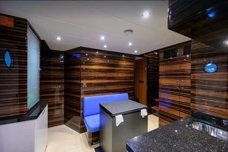 Slide: The Image of Luxurious 2014 Hampton Fly yacht interior with sleek wood paneling and modern lighting. - 26