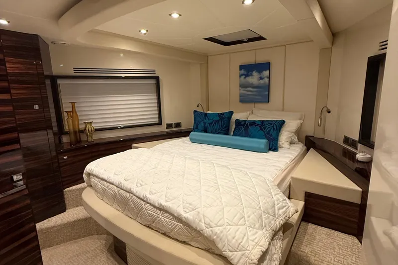 Slide: The Image of Luxurious 2014 Hampton Fly yacht bedroom with elegant decor and cozy bedding. - 31