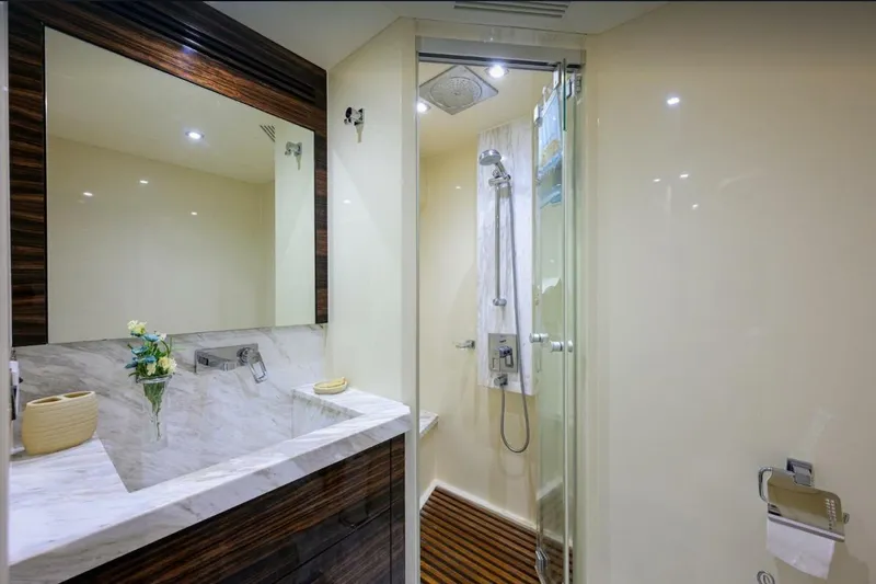 Slide: The Image of Luxurious bathroom in 2014 Hampton Fly yacht with marble sink and glass shower. - 32