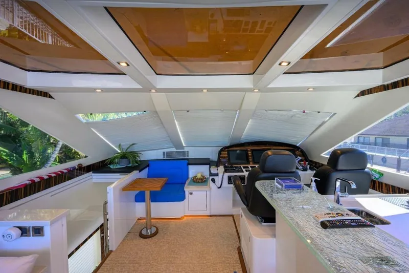 Slide: The Image of Luxurious interior of 2014 Hampton Fly yacht with modern helm and seating area. - 33