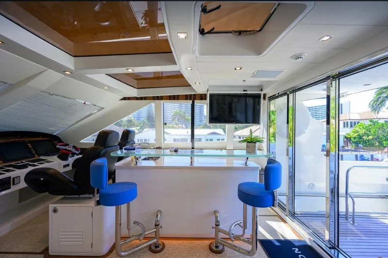 Slide: The Image of Luxurious 2014 Hampton Fly yacht interior with modern bar and seating area. - 39