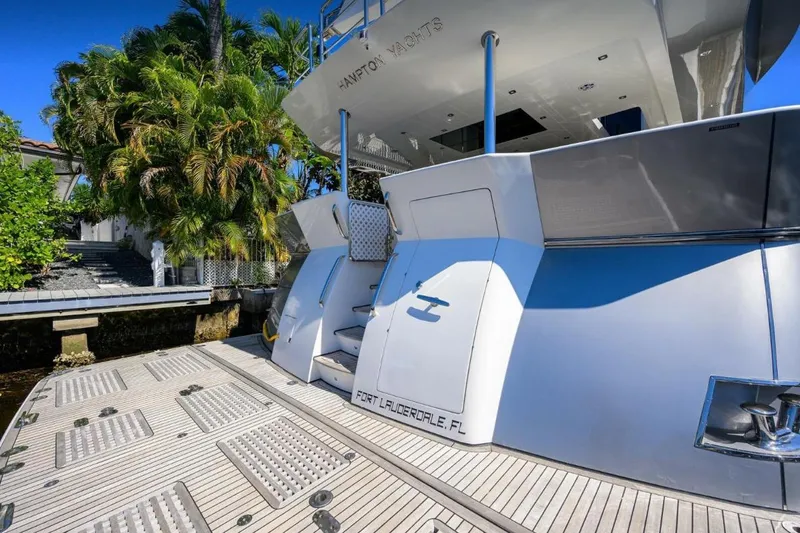 Slide: The Image of 2014 Hampton Fly yacht docked in Fort Lauderdale, surrounded by lush greenery. - 4