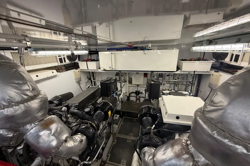 Slide: The Image of Engine room of a 2014 Hampton Fly yacht, showcasing machinery and equipment. - 41