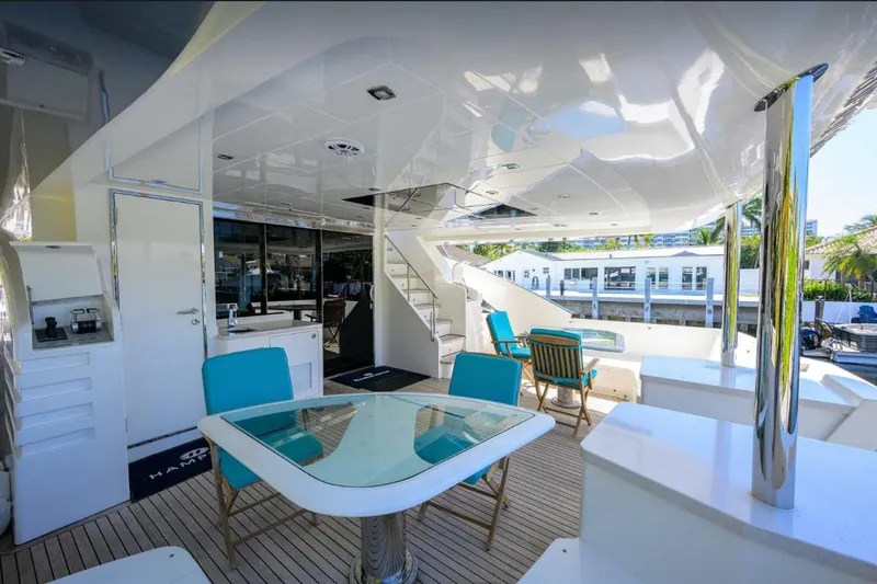 Slide: The Image of Luxurious 2014 Hampton Fly yacht deck with modern seating and elegant design. - 6