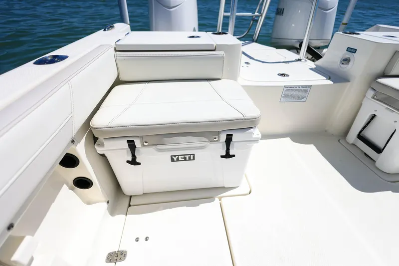 Slide: The Image of 2025 World Cat 235 TE boat interior with Yeti cooler seat on deck. - 21