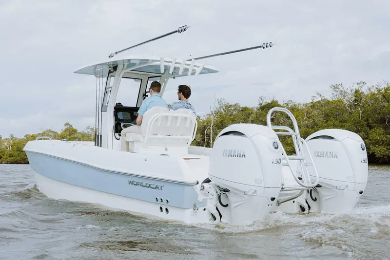 Slide: The Image of 2025 World Cat 235 TE boat with dual engines on calm water. - 4