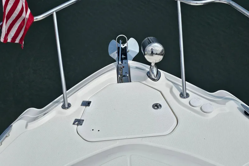 Slide: The Image of Bow of 2015 Chaparral 310 Signature with anchor and American flag. - 22
