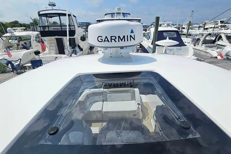 Slide: The Image of 2015 Chaparral 310 Signature yacht with Garmin radar, docked among other boats. - 25