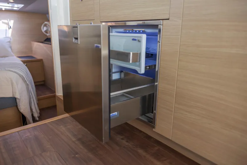 Slide: The Image of 2022 Aquila 44 Yacht docked, showcasing sleek design and modern features. - 14