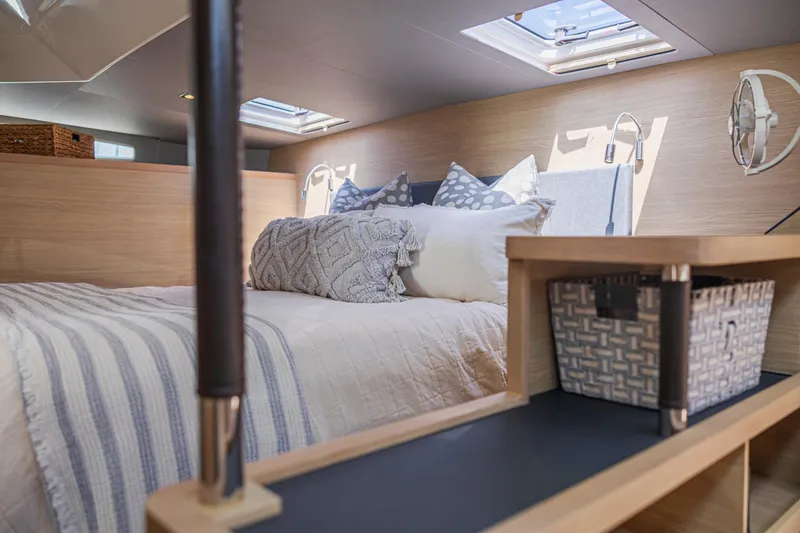 Slide: The Image of Modern kitchen area on 2022 Aquila 44 Yacht with induction cooktop and wooden cabinetry. - 21