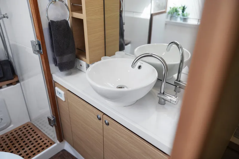 Slide: The Image of Control panel of 2022 Aquila 44 Yacht with communication equipment and switches. - 23