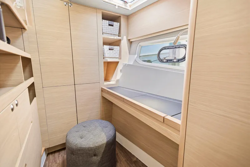 Slide: The Image of Open stainless steel refrigerator in 2022 Aquila 44 Yacht interior, showcasing modern design. - 24