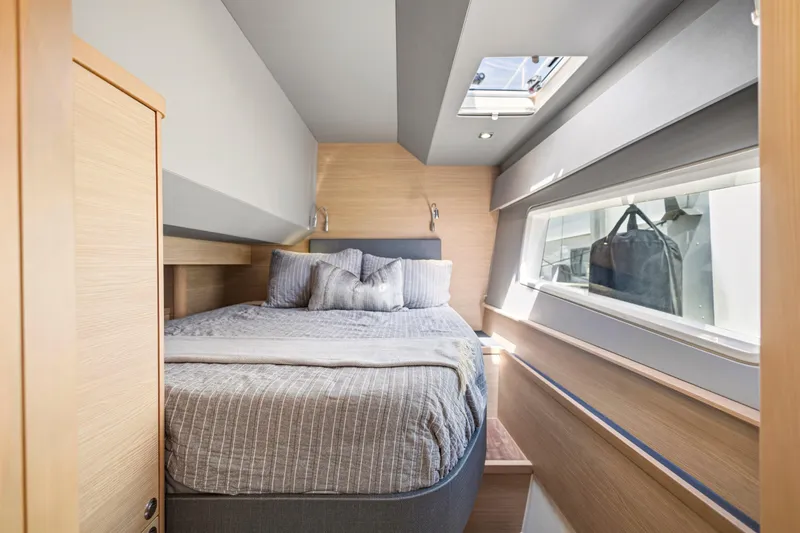 Slide: The Image of Luxurious interior of 2022 Aquila 44 Yacht with modern dining area and cozy cabin. - 25