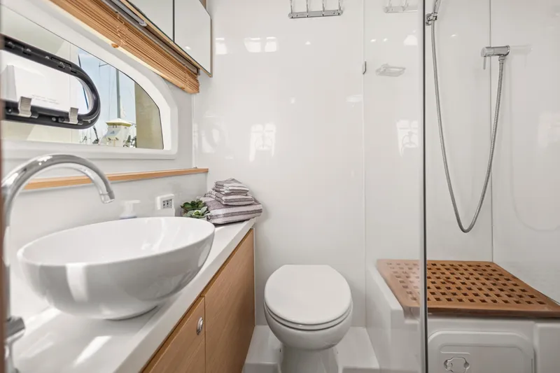 Slide: The Image of Luxurious interior of 2022 Aquila 44 Yacht with dining area and cozy cabin. - 26