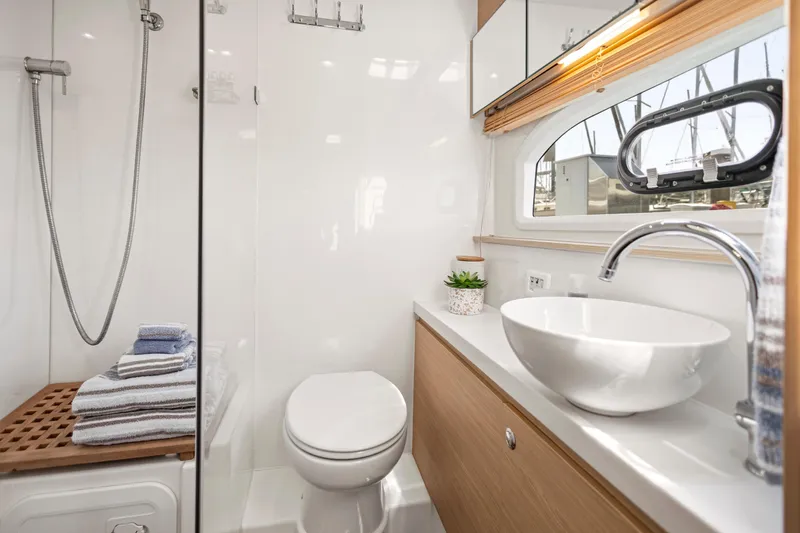 Slide: The Image of Interior of 2022 Aquila 44 Yacht with speaker, wicker baskets, and air freshener. - 29