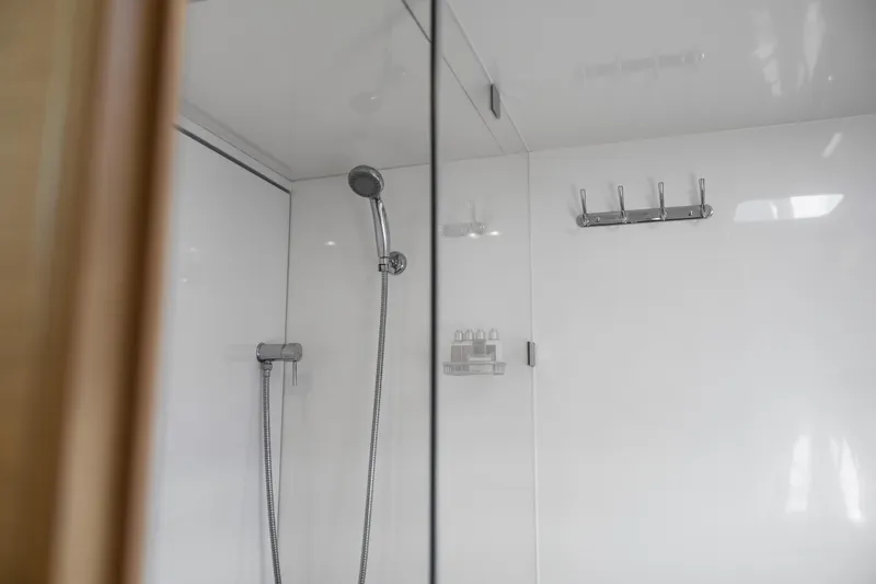 Slide: The Image of Luxurious bedroom interior of 2022 Aquila 44 Yacht with modern design and cozy bedding. - 31