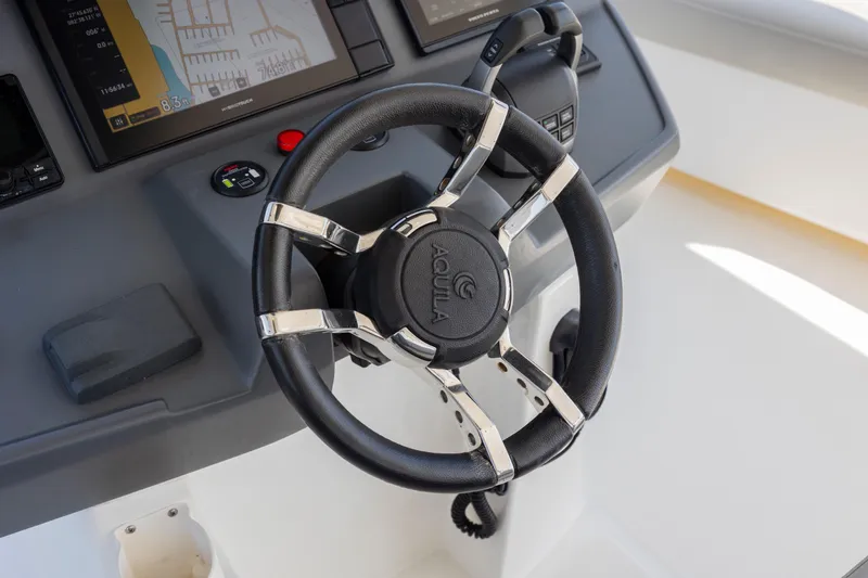 Slide: The Image of Interior of 2022 Aquila 44 Yacht with modern wood cabinetry and seating. - 36