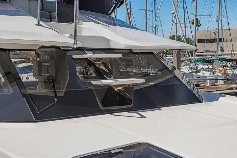 Slide: The Image of Aquila 44 Yacht 2022 on open sea, rear view with clear blue sky. - 4