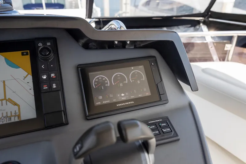 Slide: The Image of Control panel of 2022 Aquila 44 Yacht featuring navigation and engine displays. - 50