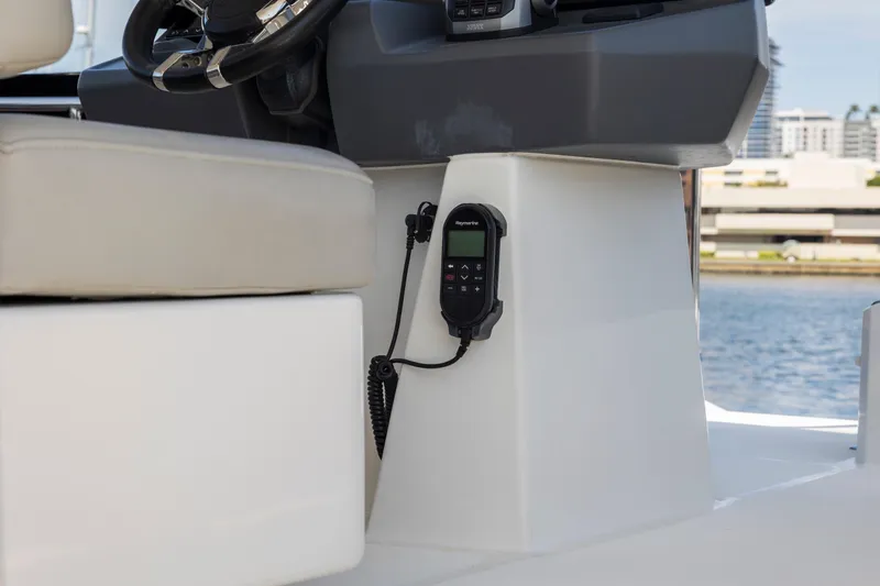 Slide: The Image of Helm station of 2022 Aquila 44 Yacht with Raymarine equipment and comfortable seating. - 51
