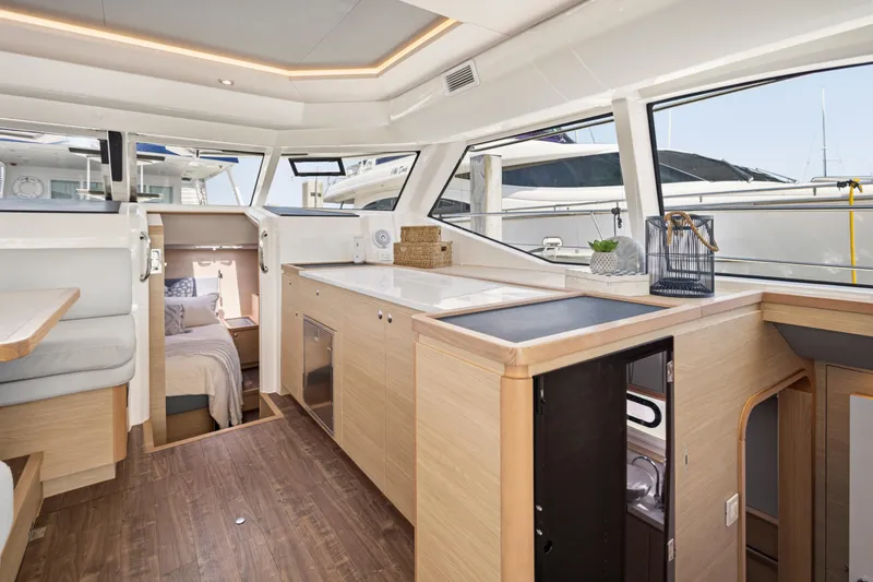 Slide: The Image of 2022 Aquila 44 Yacht docked at marina with clear blue sky. - 8