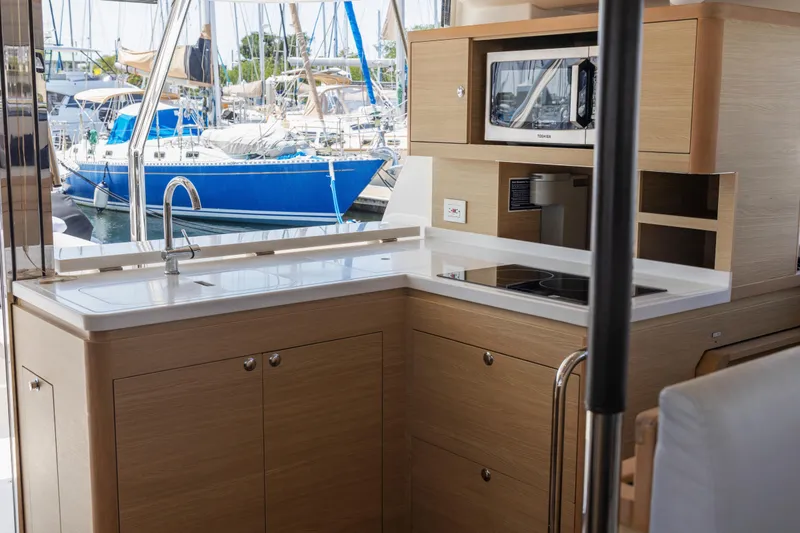 Slide: The Image of Aquila 44 Yacht 2022 docked, featuring spacious deck and sleek design. - 9