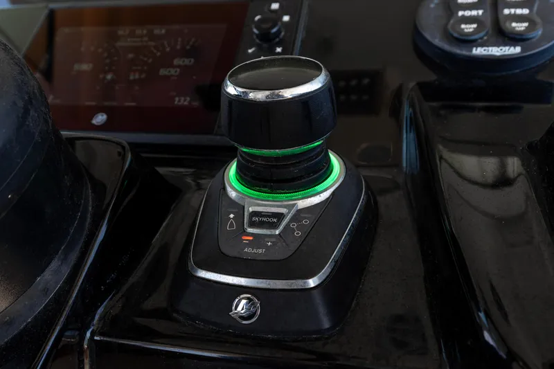 Slide: The Image of Control panel of 2020 Scout 355 LXF boat with joystick and digital display. - 15