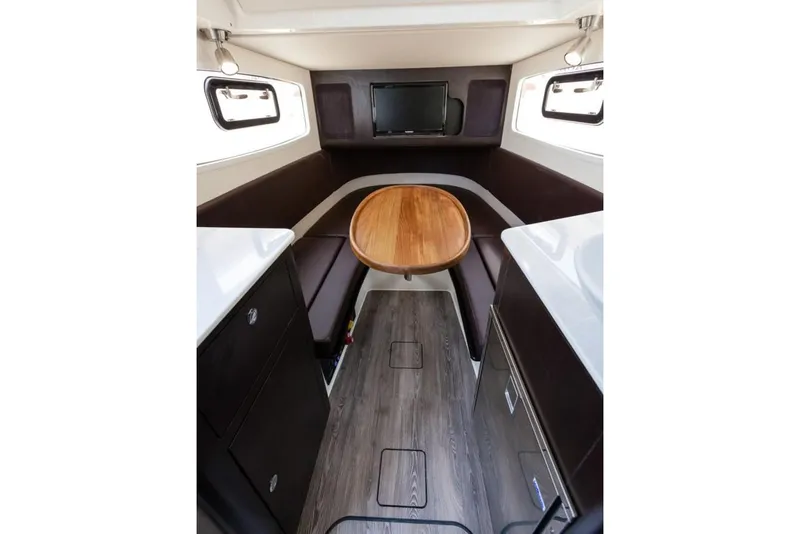 Slide: The Image of Manufacturer Provided Image: 2020 Scout 355 LXF cabin interior with seating, table, and TV. - 24
