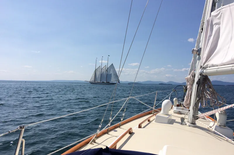 Slide: The Image of Sailing on a 1971 Luders 33 yacht with a schooner in the distance on a sunny day. - 3