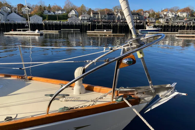 Slide: The Image of Bow of a 1971 Luders 33 sailboat docked in a scenic harbor. - 4