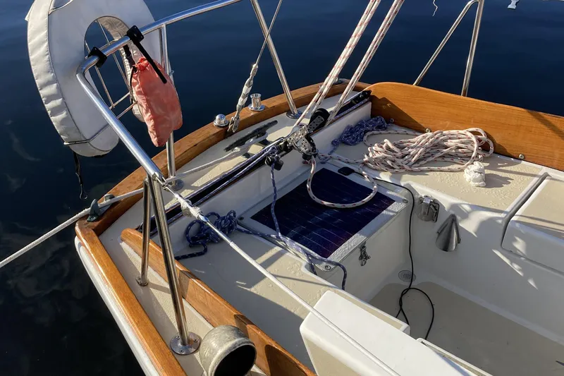 Slide: The Image of Cockpit of a 1971 Luders 33 sailboat with ropes and life preserver. - 5