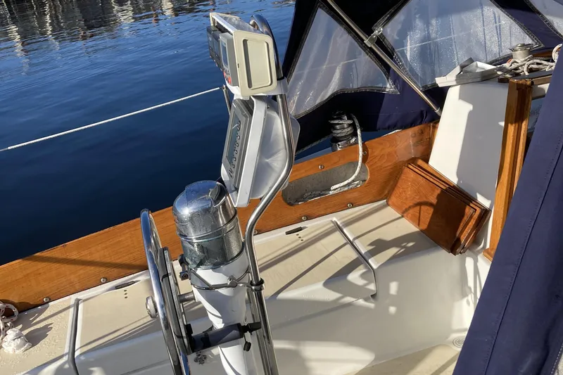 Slide: The Image of Cockpit of a 1971 Luders 33 sailboat with steering wheel and navigation equipment. - 6