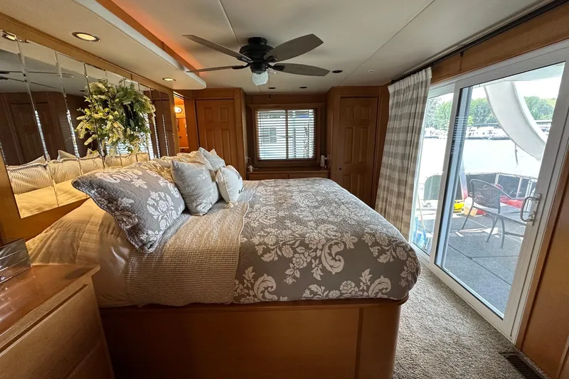 Slide: The Image of Luxurious bedroom in 2008 Starlite 18x85 houseboat with elegant decor and lake view. - 14