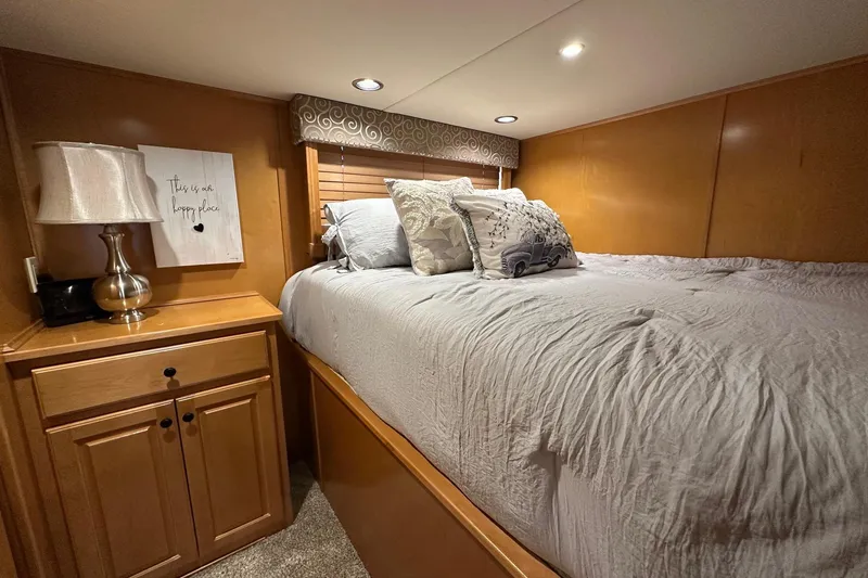 Slide: The Image of Cozy bedroom in 2008 Starlite 18x85 houseboat with wooden cabinetry and soft lighting. - 7