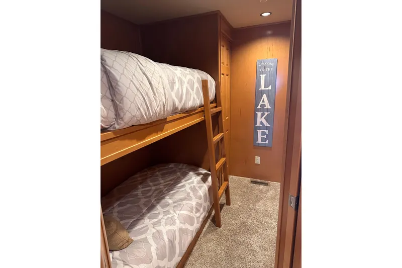Slide: The Image of Bunk beds in cozy room with "Welcome to the Lake" sign, Starlite 18x85, 2008. - 8