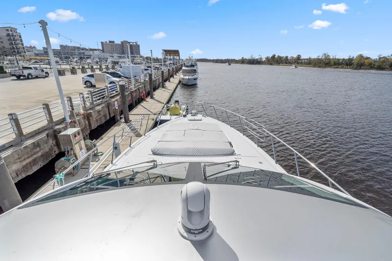 Slide: The Image of Bow view of 2010 Mangusta 72 Express yacht docked at a marina. - 13