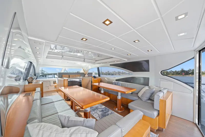 Slide: The Image of Luxurious interior of 2010 Mangusta 72 Express yacht with elegant seating and dining area. - 17