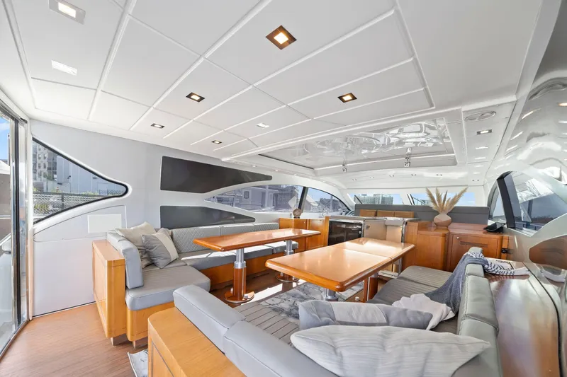 Slide: The Image of Luxurious interior of 2010 Mangusta 72 Express yacht with modern seating and dining area. - 18