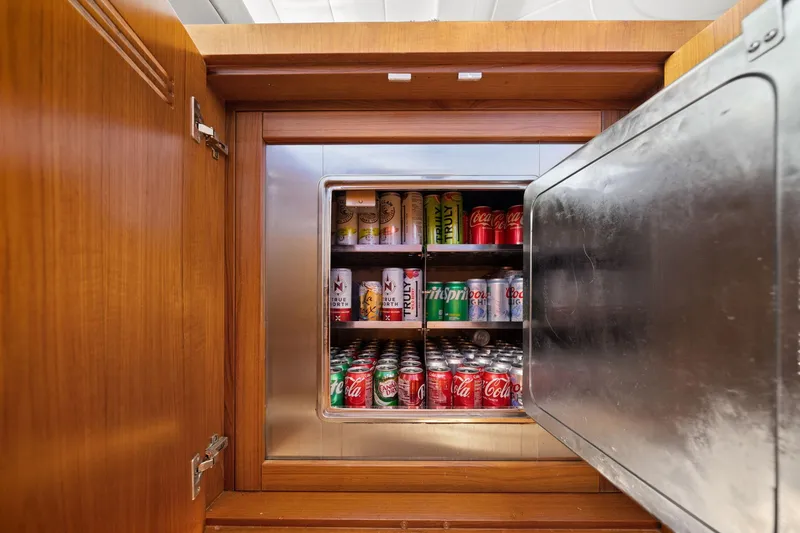 Slide: The Image of Refrigerator stocked with assorted soda cans on Mangusta 72 Express yacht, 2010 model. - 20