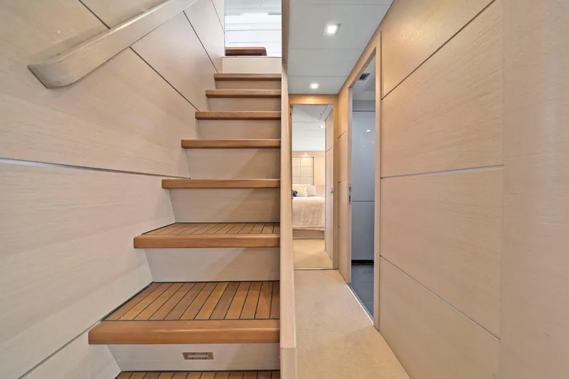 Slide: The Image of Interior of 2010 Mangusta 72 Express yacht with wooden stairs and modern design. - 24