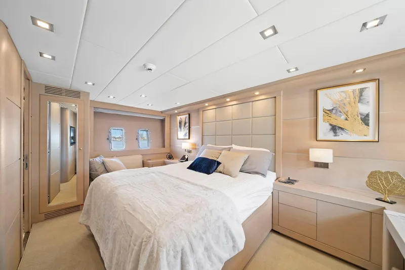 Slide: The Image of Luxurious bedroom interior of 2010 Mangusta 72 Express yacht with modern decor and elegant furnishings. - 25