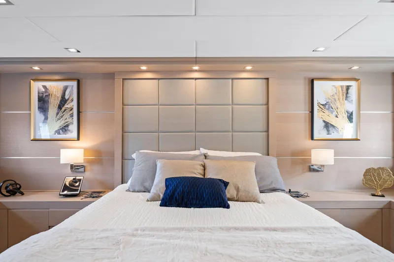 Slide: The Image of Luxurious bedroom interior on 2010 Mangusta 72 Express yacht, featuring elegant decor and modern lighting. - 26