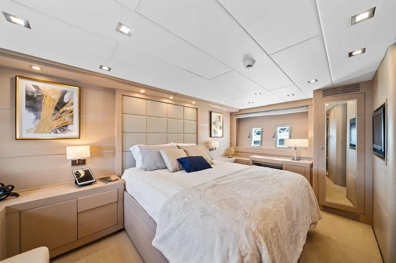 Slide: The Image of Luxurious bedroom interior of 2010 Mangusta 72 Express yacht with modern decor and elegant furnishings. - 27