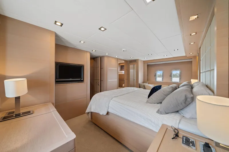 Slide: The Image of Luxurious bedroom interior of 2010 Mangusta 72 Express yacht with modern design and cozy ambiance. - 29