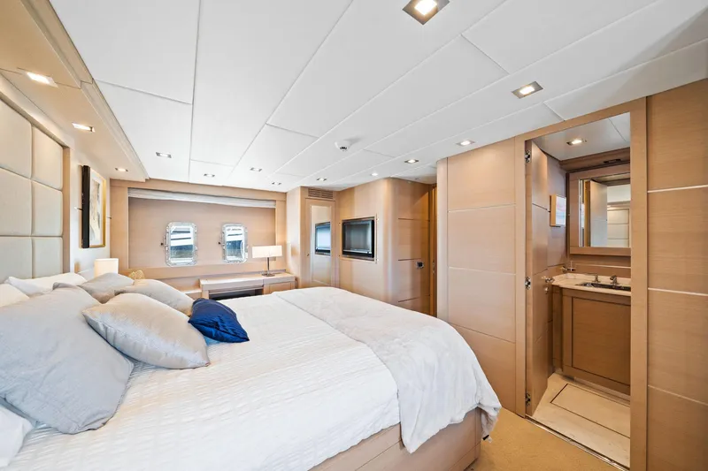 Slide: The Image of Luxurious bedroom interior of 2010 Mangusta 72 Express yacht with modern design and elegant furnishings. - 30