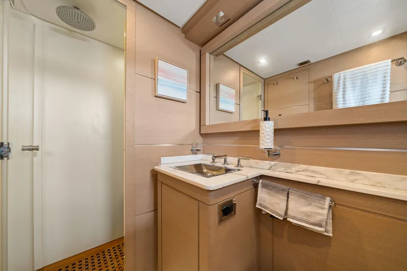 Slide: The Image of Luxurious bathroom in 2010 Mangusta 72 Express yacht with modern fixtures and elegant design. - 32