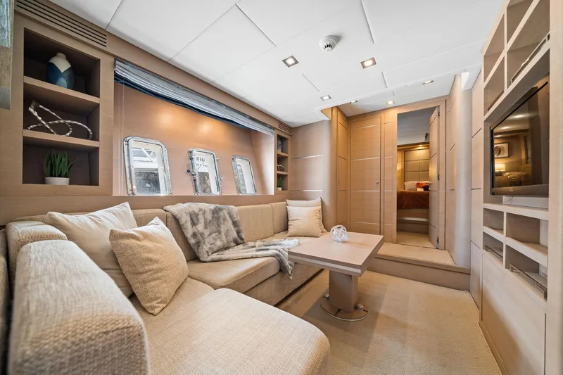 Slide: The Image of Luxurious interior of 2010 Mangusta 72 Express yacht with elegant seating and modern decor. - 36