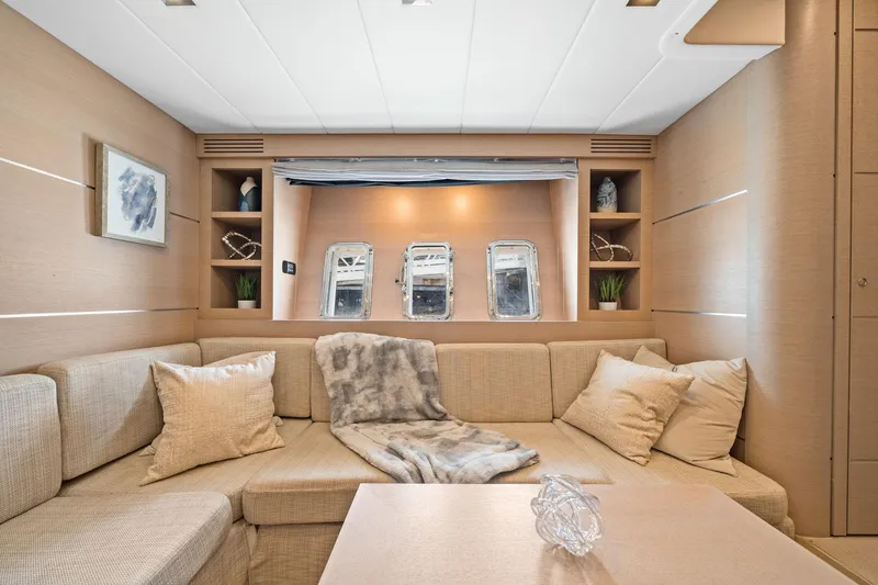 Slide: The Image of Luxurious interior of 2010 Mangusta 72 Express yacht with cozy seating and elegant decor. - 37