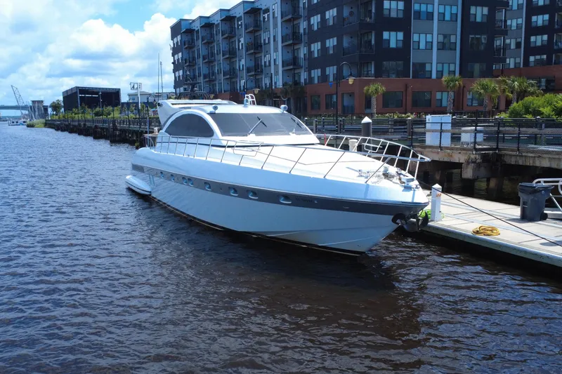 Slide: The Image of Luxury 2010 Mangusta 72 Express yacht docked by urban waterfront. - 4