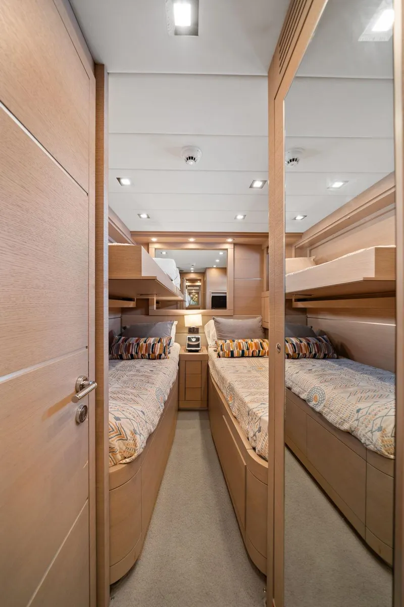 Slide: The Image of Luxurious interior of 2010 Mangusta 72 Express yacht with twin beds and modern design. - 42